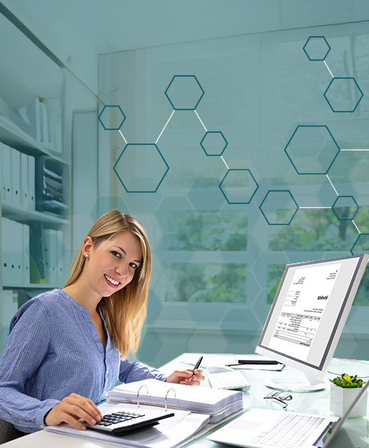 Experienced fractional accountant using a calculator and reviewing financial reports at Afinida Accounting in Escondido.